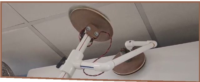 Close-up of the dual-sided rotating mop clamp mechanism